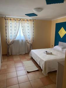 Postel nebo postele na pokoji v ubytování Vista sul Lago