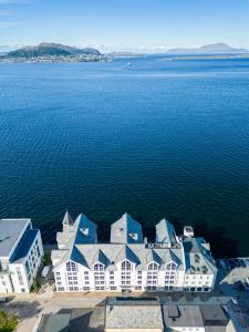an aerial view of a building on the water at Quality Hotel Ålesund in Ålesund +59 photos