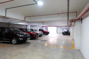 a garage with a bunch of cars parked in it at celestia by thoppil in Kottakkal