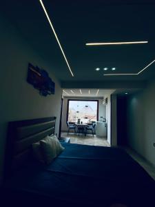 a bedroom with a bed and a view of a table at Pyramids Fort & free pickup shuttle in Cairo