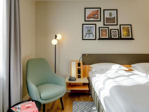 Postel nebo postele na pokoji v ubytování Mercure Hotel Bochum City
