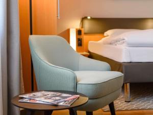 Postel nebo postele na pokoji v ubytování Mercure Hotel Bochum City