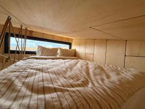 Postel nebo postele na pokoji v ubytování Tiny hill