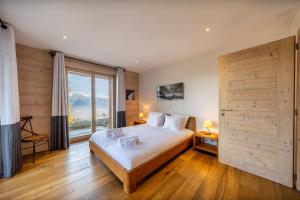 Postel nebo postele na pokoji v ubytování Chalet Casse-Noisette wonderful, ski-in ski-out