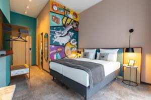 Ένα ή περισσότερα κρεβάτια σε δωμάτιο στο Holiday Inn - the niu, Pax Berlin Airport by IHG