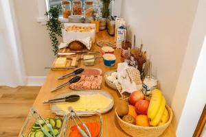 a table topped with lots of different types of food at The Stykkishólmur Inn by Ourhotels in Stykkishólmur +22 photos