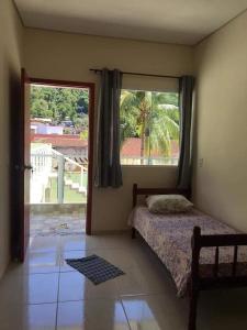 Una cama o camas en una habitación de Suítes litoral