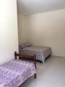 Una cama o camas en una habitación de Suítes litoral