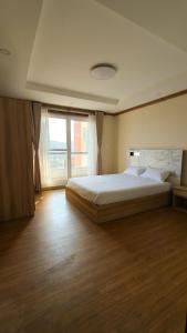 Ένα ή περισσότερα κρεβάτια σε δωμάτιο στο Santi apartment