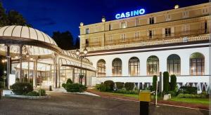a large building with a sign on top of it at Spacious N3, quiet,great location in Divonne-les-Bains