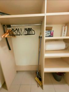 a walk in pantry with a shelf with utensils at Spacious N3, quiet,great location in Divonne-les-Bains