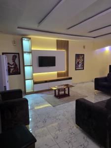 TV a/nebo společenská místnost v ubytování Riverview Apartment