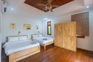 Giường trong phòng chung tại 4 Bed Songthai - 5 +60 ảnh