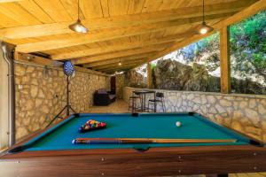 a pool table in a room with a ceiling at Paun in Bribir