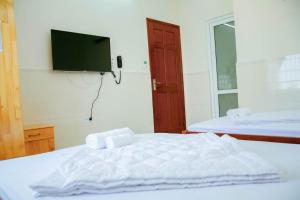 Ένα ή περισσότερα κρεβάτια σε δωμάτιο στο Bích Thảo Hotel