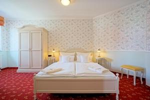 Postel nebo postele na pokoji v ubytování Hotel Godewind