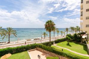 a view of the ocean from the balcony of a building at Primera línea de playa Marbella in Marbella