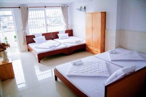 Ένα ή περισσότερα κρεβάτια σε δωμάτιο στο Bích Thảo Hotel