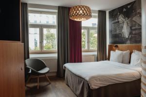 Postel nebo postele na pokoji v ubytování Home Hotel Uppsala