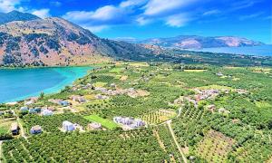 an aerial view of a village next to the water at Ferienhaus Für 16 Personen In Episkopi, Kreta West Kreta in Episkopí- Rethimno +25 photos