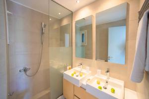 a bathroom with a sink and a shower at Elounda Garden Maxima Suite Beheiztes Schwimmbad in Elounda