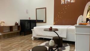 Ένα ή περισσότερα κρεβάτια σε δωμάτιο στο Nhà nghỉ Candy's House - Cần Thơ