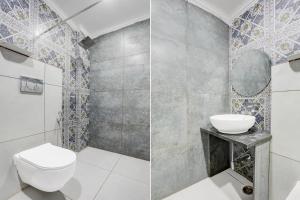 un baño con inodoro y lavabo en Palette Heritage Varanasi Retreat, en Varanasi