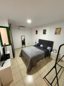 Ένα ή περισσότερα κρεβάτια σε δωμάτιο στο Casa Tamarán