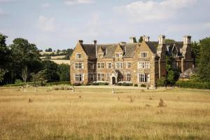 an old house in the middle of a field at The Silvan Lodge, Peace, Privacy, and Pure calm 