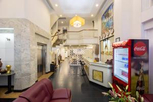 a store with a cocacola machine in the middle of a hallway at A25 Hotel - 251 Hai Bà Trưng HCM in Ho Chi Minh City +39 photos