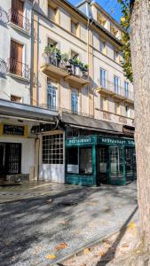 an empty street in front of a building at Appartement 6 pers allée d étigny in Luchon +10 photos