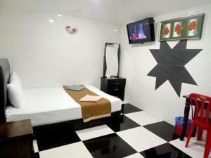 Postel nebo postele na pokoji v ubytování Kepong Business Hotel