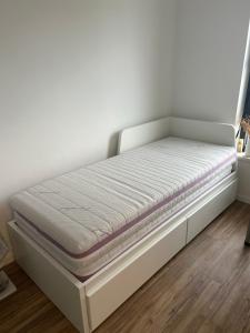 Ένα ή περισσότερα κρεβάτια σε δωμάτιο στο Cosy Host