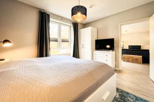 Ένα ή περισσότερα κρεβάτια σε δωμάτιο στο Residenz Seestern Wohnung 40 +41 φωτογραφίες