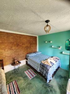 Postel nebo postele na pokoji v ubytování Casa Bantu - Vila Rosa