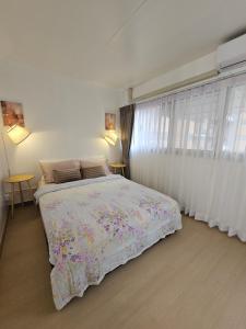 Ένα ή περισσότερα κρεβάτια σε δωμάτιο στο P-Phen popular condo