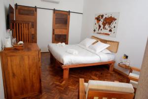 Postel nebo postele na pokoji v ubytování Malagasy Grace Résidence