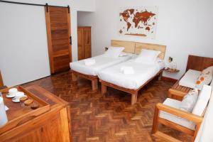 Postel nebo postele na pokoji v ubytování Malagasy Grace Résidence + 8 fotografií