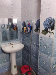 a bathroom with a sink and a mirror at Sana Studio in Weligama