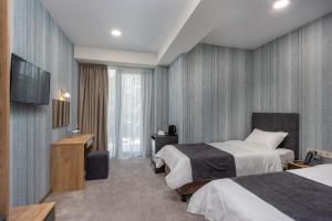 Postel nebo postele na pokoji v ubytování Flames boutique + 15 fotografií