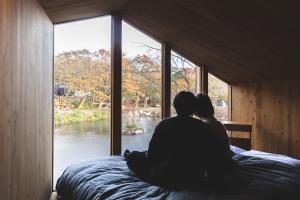 Postel nebo postele na pokoji v ubytování Earthboat Nasu