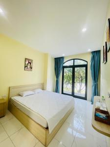 Ένα ή περισσότερα κρεβάτια σε δωμάτιο στο Lavender Cafe