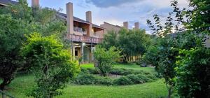 a large house with a garden in front of it at Wild View Resort in Kasane