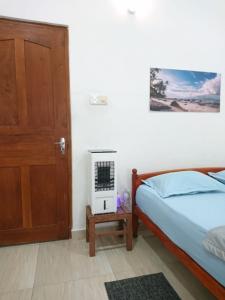 Postel nebo postele na pokoji v ubytování CANAAN MUSIC Hotel