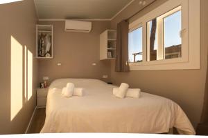 Postel nebo postele na pokoji v ubytování Camping Vidrà