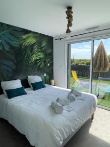 Ένα ή περισσότερα κρεβάτια σε δωμάτιο στο Villa Noz Vat 4 étoiles avec SPA