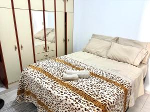 Ένα ή περισσότερα κρεβάτια σε δωμάτιο στο Apartamento inteiro +55 φωτογραφίες