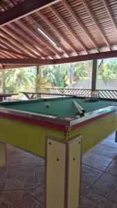 a pool table sitting on top of a patio at Rancho com acesso direto ao rio, área verde e lazer completo in Santa Fé do Sul +89 photos