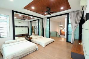 Ένα ή περισσότερα κρεβάτια σε δωμάτιο στο 超豪华双层半独立别墅 Batu Pahat