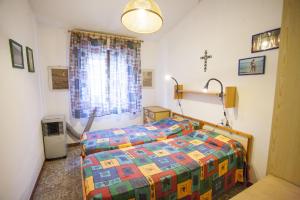 Postel nebo postele na pokoji v ubytování Villetta Bel Giardino